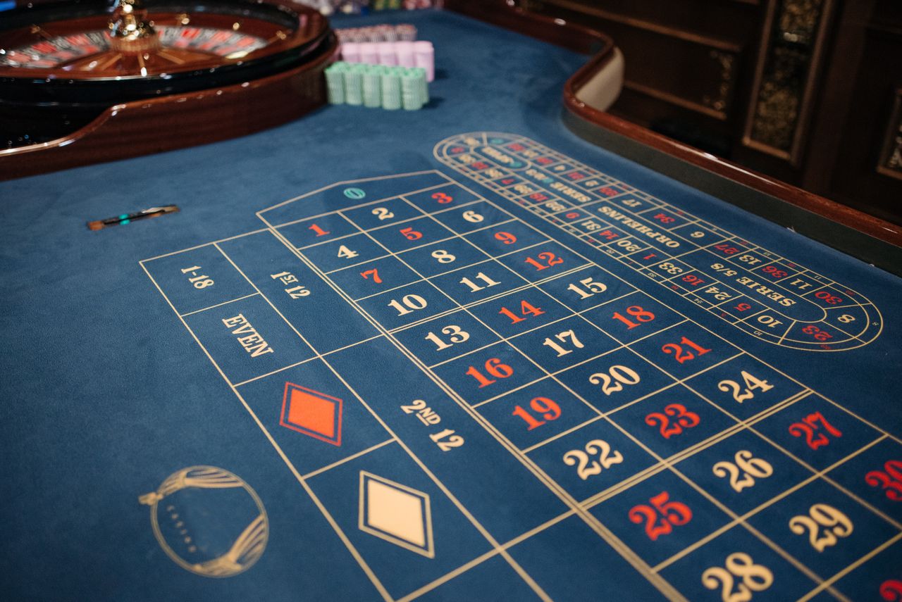 Navy and gold roulette table ready for evening play